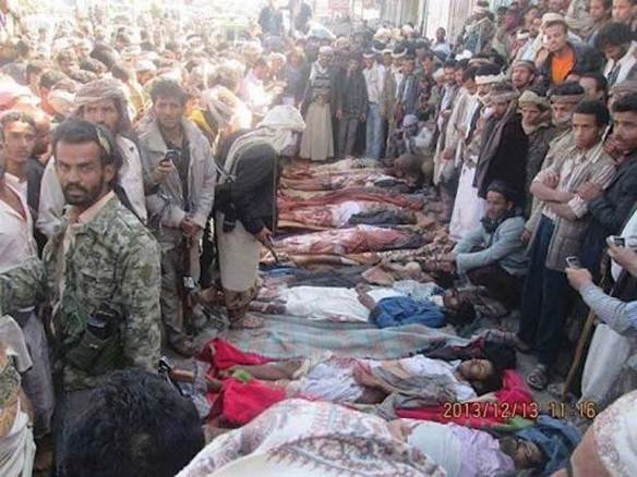 Bodies of nine men killed in a U.S. drone strike on December 12, 2013 are readied for burial near Radda, Yemen. Photo by Nasser Al-Sane for Reprieve. 