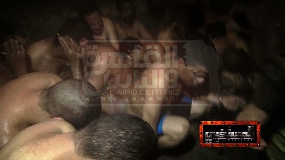 Photo taken and publicized by Egyptian journalist Mona Iraq, showing arrested victims of the 2014 Cairo bathhouse raid over which she presided