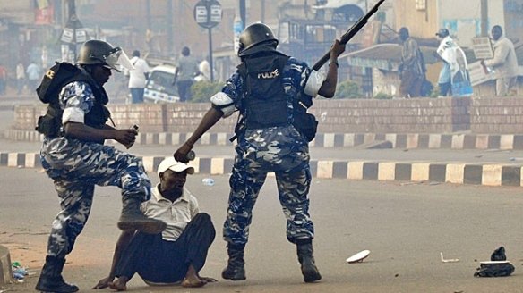 Ugandan policemen beat a supporter of the opposition Forum for Democratic Changeat a Kampala protest against Museveni's 2011 re-re-re-re-inauguration. Photo: James Akena for Reuters