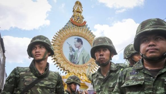Thai soldiers gather under a portrait of the king following the 2014 coup: EPA/Diego Azubel 